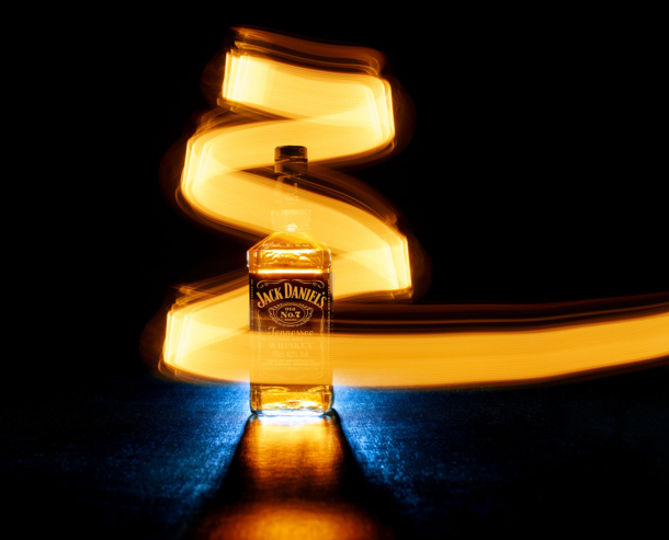 Cheap photo lighting technique using a lightbulb and a bottle of Jack Daniels